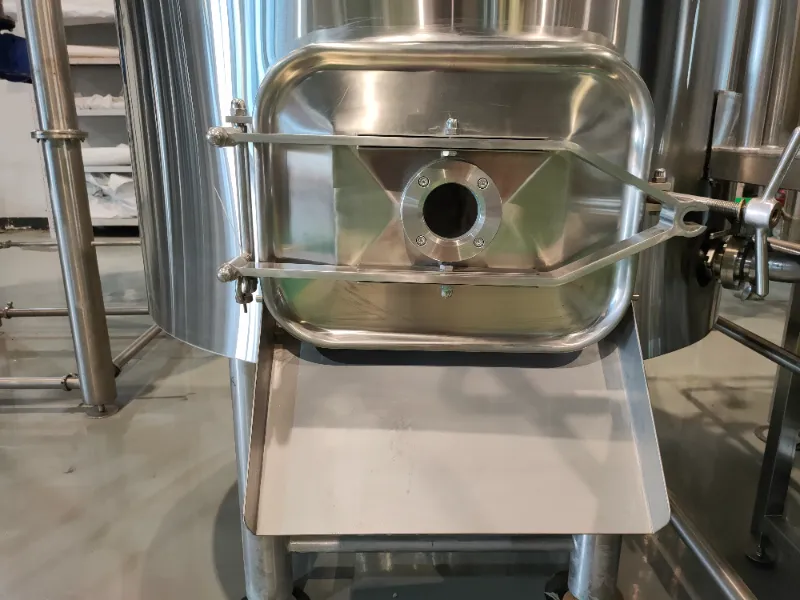 Spent grain door and chute for lauter tuns, designed for discharging spent grain after lautering. Stainless steel construction with a sealed door and angled chute for controlled, hygienic removal.